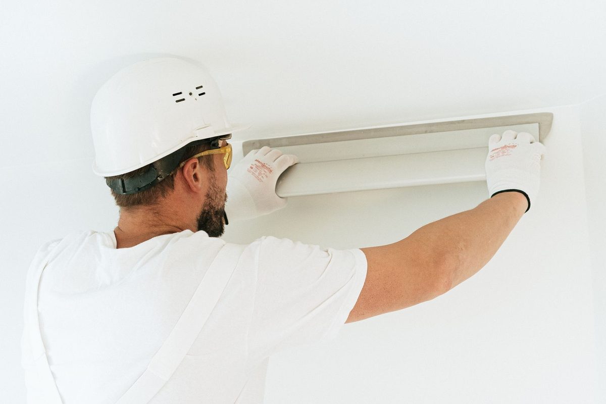 Painter working on a building exterior