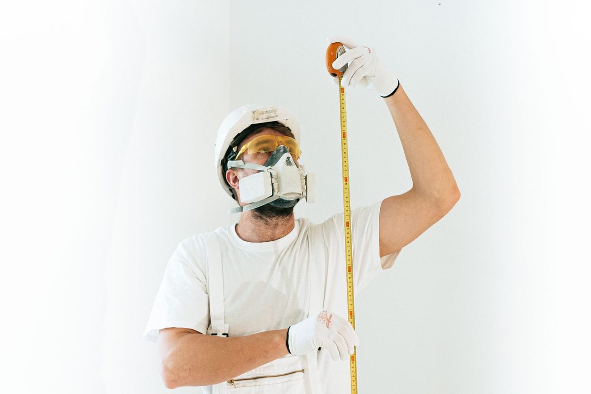 Painter at work on an interior wall